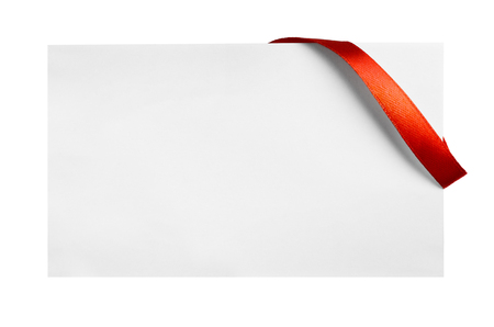 Red silk ribbon on empty paper cardの写真素材
