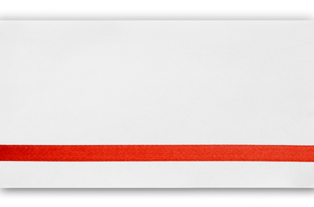 Red silk ribbon on empty paper cardの写真素材