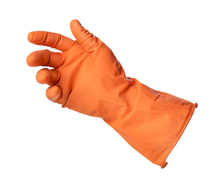 Hand with orange rubber glove holds something isolated on white backgroundの写真素材
