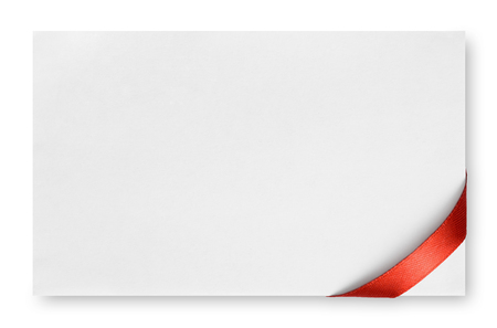 Red silk ribbon on empty paper cardの写真素材
