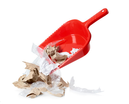 Red shovel with litter isolated on white backgroundの写真素材