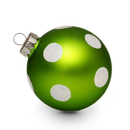 Green christmas ball with spots isolated on white backgroundの写真素材