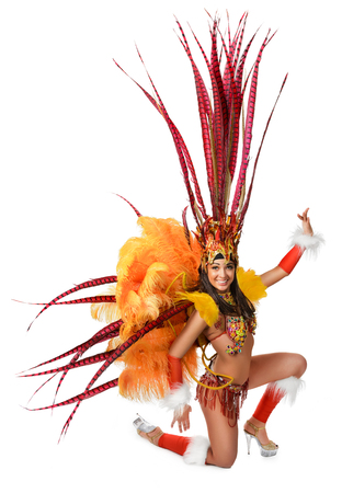 Smiling beautiful girl in a colorful carnival costumeの写真素材