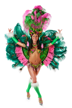 Smiling beautiful girl in a colorful carnival costumeの写真素材