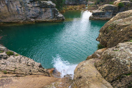 Beautiful view of turquoise water of a river in the mountainsの写真素材