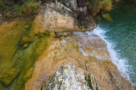 Mountain river with turquoise water and stones in autumn.の写真素材