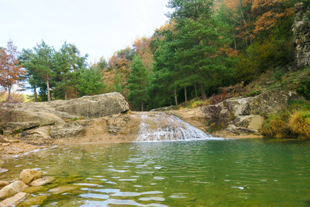 Beautiful waterfall in the forest in autumn. Landscape of nature.の写真素材