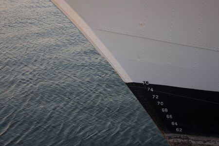 Quiet nautical life reflected in a large frigate