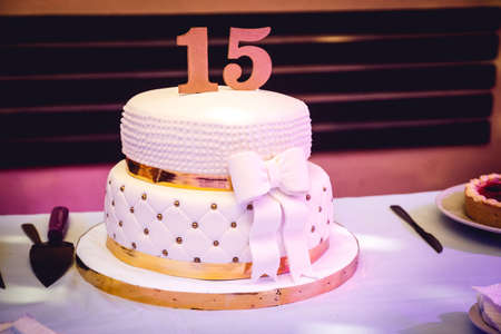 15th birthday cake and details of the decoration of the partyの写真素材