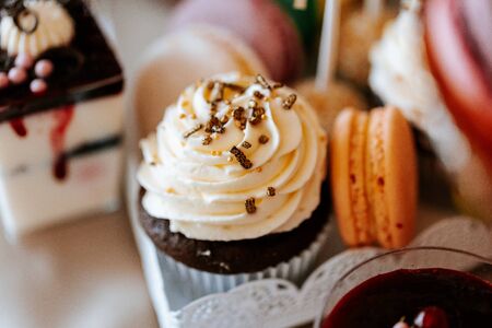 Creamy sweets, candy, muffin and macaronsの写真素材