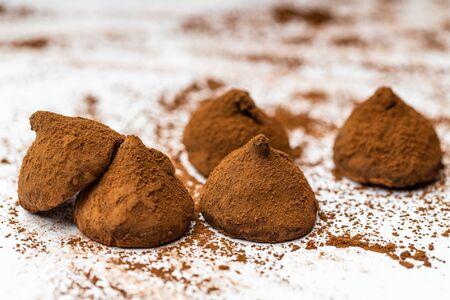 Sweet spiced handcrafted pralines on white isolated background.