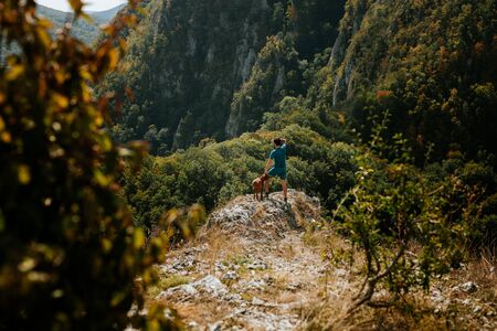 Forest hiker in transilvanian mountains with beautiful viewの写真素材