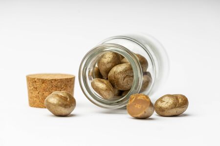 Sweet spiced handcrafted pralines on white isolated background.の写真素材