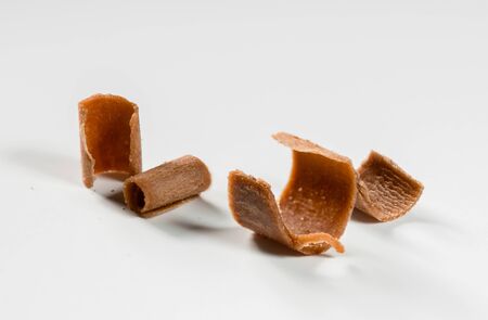 group of chocolate shavings isolated on white backgroundの写真素材