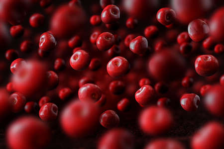 Flying or levitated cherries on a dark background with steam or water particles