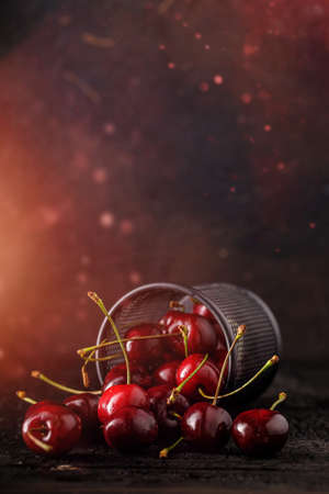 still life of red, juicy cherries on a dark background. Group of cherry.の写真素材