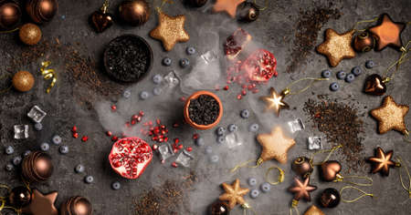 Christmas and hookah concept with glittering ornaments. Hookah ceramic head fulled with aromated...