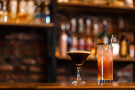 Hot and cold cocktails in the bar. Delicious alcoholic drink. Blurred background in a bar or clubの写真素材