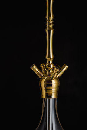 closeup details of modern minimalist hookah. Sheesha or waterpipe parts isolated on black background