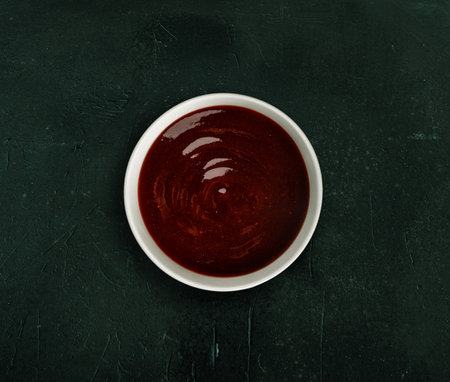 Delicious barbeque sauce in a white bowlの写真素材