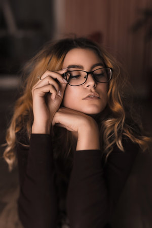 Young beautiful female model posing with glassesの写真素材