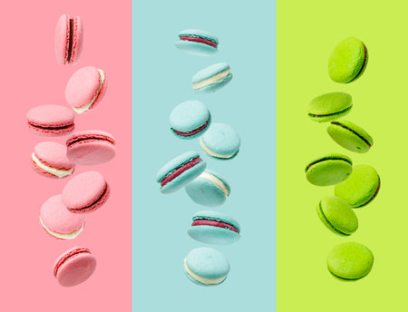 Colorfull macaroons levitated on pink, blue and green backgroundの写真素材