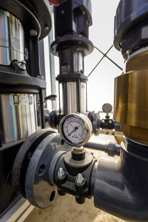 Close up of water pressure sensor or manometer with pipes and valves. Industrial conceptの写真素材