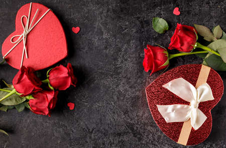 Celebration concept for Saint Valentines day or birthday with hearth shaped gift box and bouquets of...