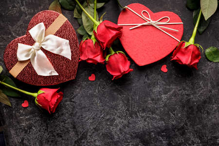 Celebration concept for Saint Valentines day or birthday with hearth shaped gift box and bouquets of...