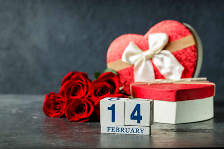 Valentines day concept with red roses and cube calendar. 14 of february, celebration dayの写真素材