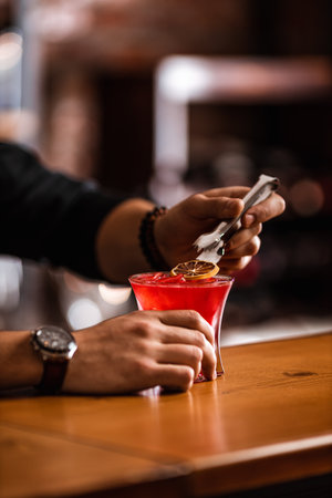 bartender prepares a cocktail in tha barの写真素材