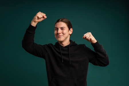 winner expression of a young man. Cropped studio portrait of male moodの写真素材