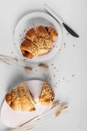 Homemade freshly bakery products with powdered sugar on the top top view and wheatの写真素材