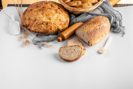 Homemade delicious freshly baked heathy natural bread food group on gray background