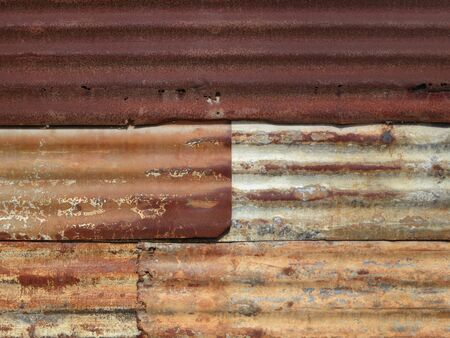 Wall of corrugated iron sheet in a poor district of Inhambane, Mozambique, Africaの写真素材