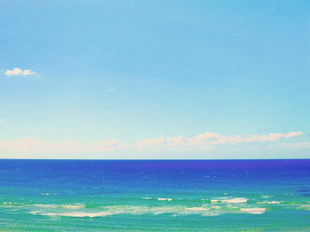 Sea background, waves and blue sky with cloudsの写真素材