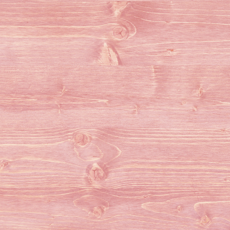 Pink, rustic wood texture with knotholesの写真素材
