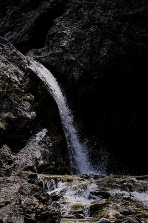 Waterfall in the mountains of the Pyrenees, Spain. Beautiful landscape in an evening mood by the water in the sunshine.の写真素材