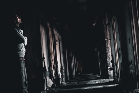 dark corridor and the man in a gloomの写真素材