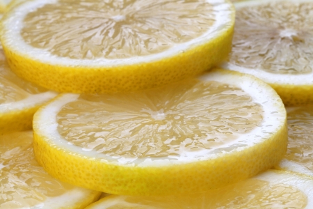 slices of fresh lemon on full screenの写真素材