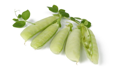 fresh green peas isolated on a white backgroundの写真素材