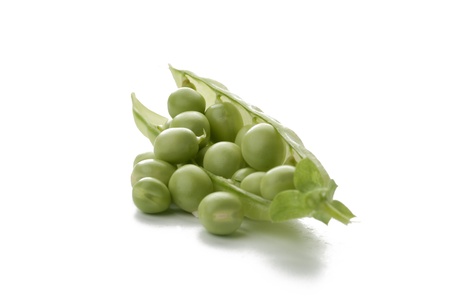 Ripe pea vegetable with green leaf isolated on white backgroundの写真素材