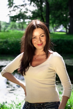 Beautiful young woman in the park. Outdoor portraitの写真素材