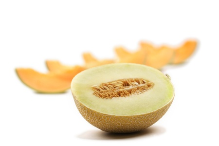 sliced melon isolated on white backgroundの写真素材
