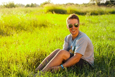 Handsome man in the park. Funny shotの写真素材