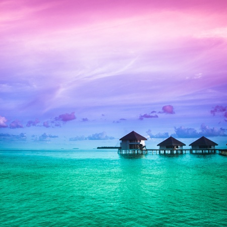 Over water bungalows with steps into amazing green lagoonの写真素材