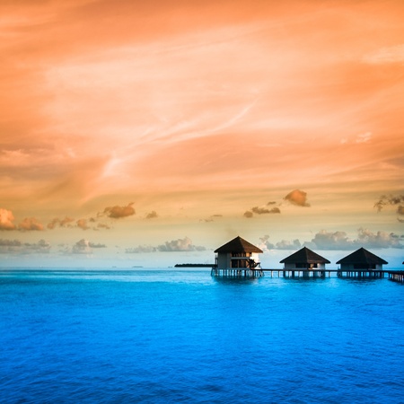 Over water bungalows with steps into amazing green lagoonの写真素材