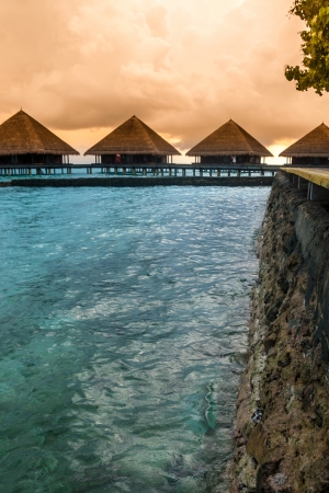 View of water villas resort on a Maldives island, shot with a tilt and shift lensの写真素材