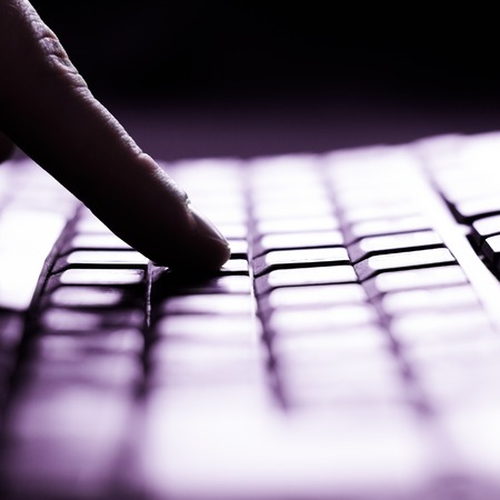 Close-up of typing male hands on keyboard
