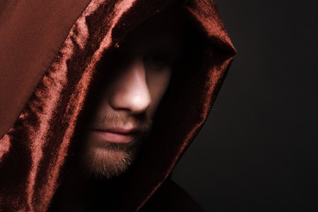 Portrait of mystery unrecognizable monk in robeの写真素材